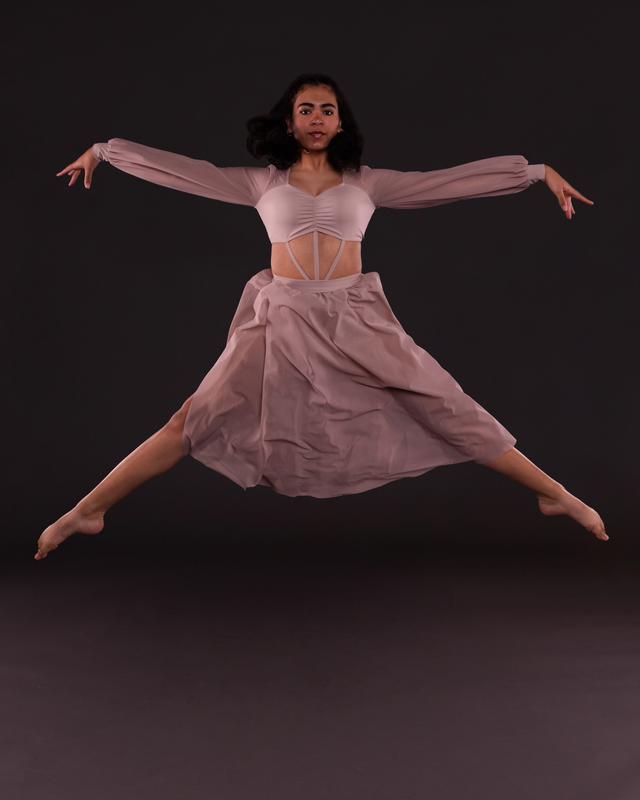 An SDI dancer mid-leap